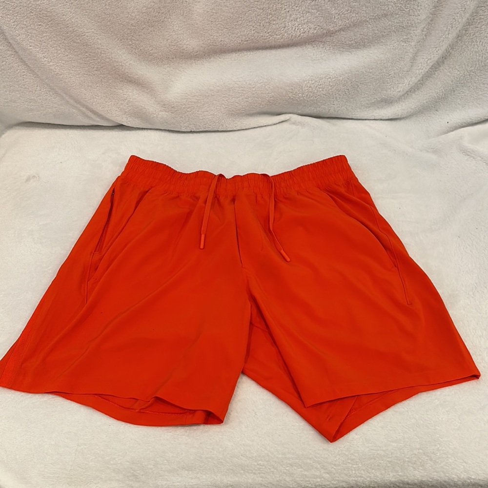 Lululemon - Pace Breaker Linerless Short
7" -  color: Solar orange - size: large